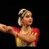 Bharatanatyam dancer Neha Sathanapalli in classical costume and expressive dance posture.