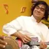 Uppalapu Srinivas smiling with mandolin player.