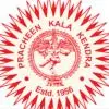 Red circular logo of Pracheen Kala Kendra featuring a classical Nataraja figure in the center, surrounded by decorative rays and the text “Estd. 1956.”