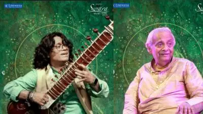 Portrait of sitar artist Ravi Chary performing, holding a sitar and wearing traditional attire, highlighting his role as a classical musician blending traditional and contemporary styles.
