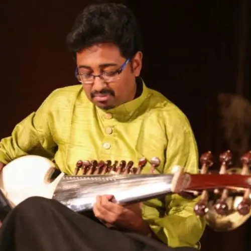 Sarod artist Abhisek Lahiri focused while playing during a live performance.