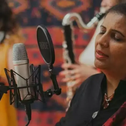 1️⃣ Deepa Shakthi performing Dhrupad vocals in studio with musicians in background