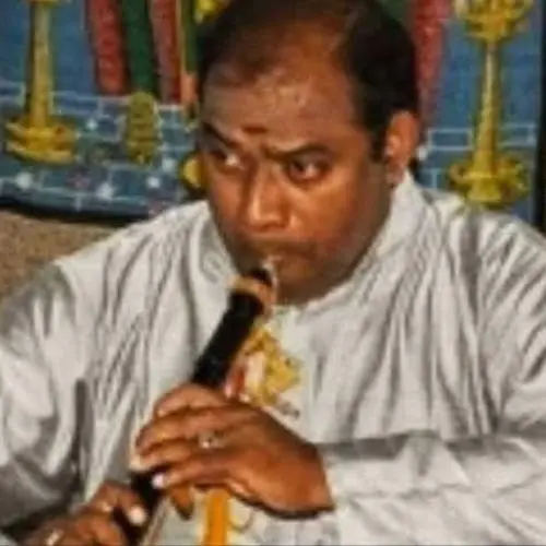 Thirumakalam T. S. Pandian performing on the nadaswaram during a traditional South Indian classical music performance.