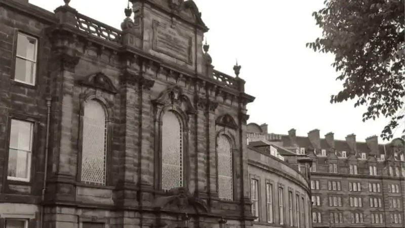 Historic exterior view of St Mark’s Unitarian Church on Castle Terrace in Edinburgh, Scotland, featuring classical stone architecture and tall arched windows.